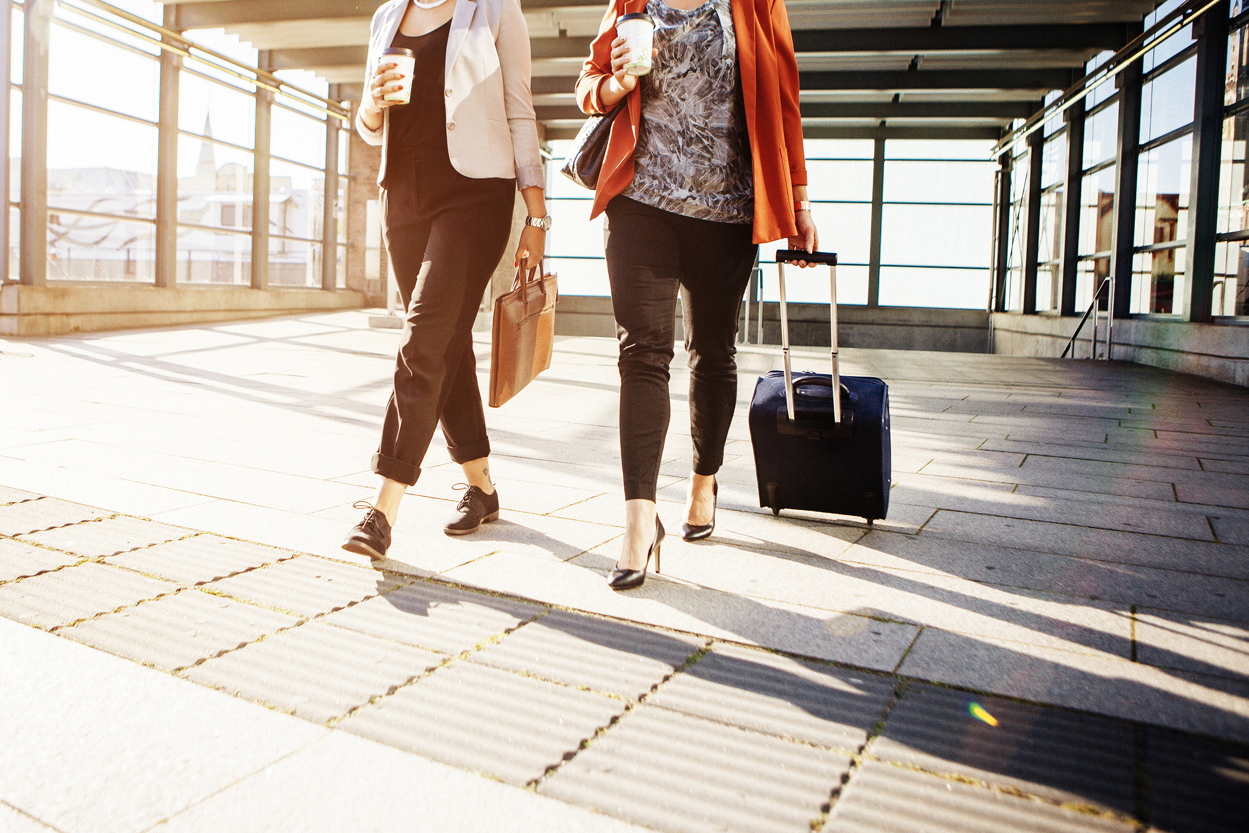 central-location-oesterreich-ladies-with-trolleys-at-the-airport